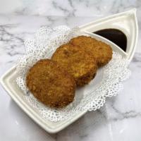 Potato Croquette · Deep-fried mashed potato cakes coated with panko - 3 pcs with katsu sauce. Vegetarian.