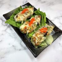 Baked Mussel · Oven-baked chopped mussels topped with mozzarella cheese, Japanese mayo, masago, and green o...