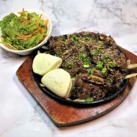 Korean BBQ Beef Short Ribs Appetizer · Grilled Korean BBQ short ribs on a bed of sautéed onions - 
 with Korean lettuce salad & 2pc...