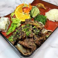 Beef Short Ribs Aka Galbi · Grilled Korean BBQ beef short ribs. Served with soup and salad.  Choice of dressing.