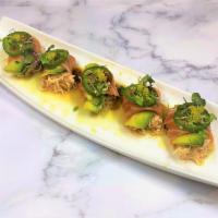 Salmon Wheel · Thinly sliced Scottish salmon rolled with crabmeat and avocado, topped with yuzu tokibo, mic...