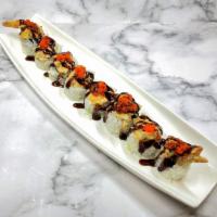 Ginza Roll · *New Item*
Shrimp tempura and avocado roll topped with baked chopped mussels, masago, and su...