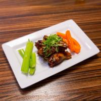 Sweet Chili Wings · Fresh jumbo drumettes and flats, charbroiled then marinated in our sweet chili sauce. Served...
