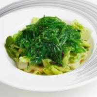 Japanese Seaweed Salad · Green seaweed with sesame seeds.