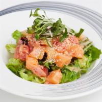 Sashimi Salad · Tuna, white tuna and salmon on mixed greens with soy vinaigrette.