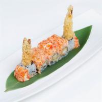Volcano Roll · Inside: shrimp tempura and eel sauce. Outside: spicy king crab and kani. Spicy.