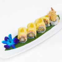 Golden Dragon Roll · Inside: shrimp tempura and cucumber. Outside: lobster salad, mango, black tobiko and golden ...
