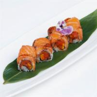 Lion Dance Roll · Inside: spicy salmon and mango. Outside: pepper salmon, wasabi mayo and mango sauce. Spicy.