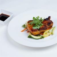 Char Grilled Chilean Sea Bass · Marinated sea bass with chef's miso sake dressing, served with mixed vegetables.