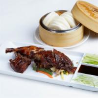 Moca Roasted Peking Duck · Peking style roasted duck, served with steamed mini buns and hoisin sauce.