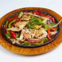Mongolian Skillet Chicken · Marinated slices and sauteed with ginger scallions, onions and bell peppers with chef's brow...