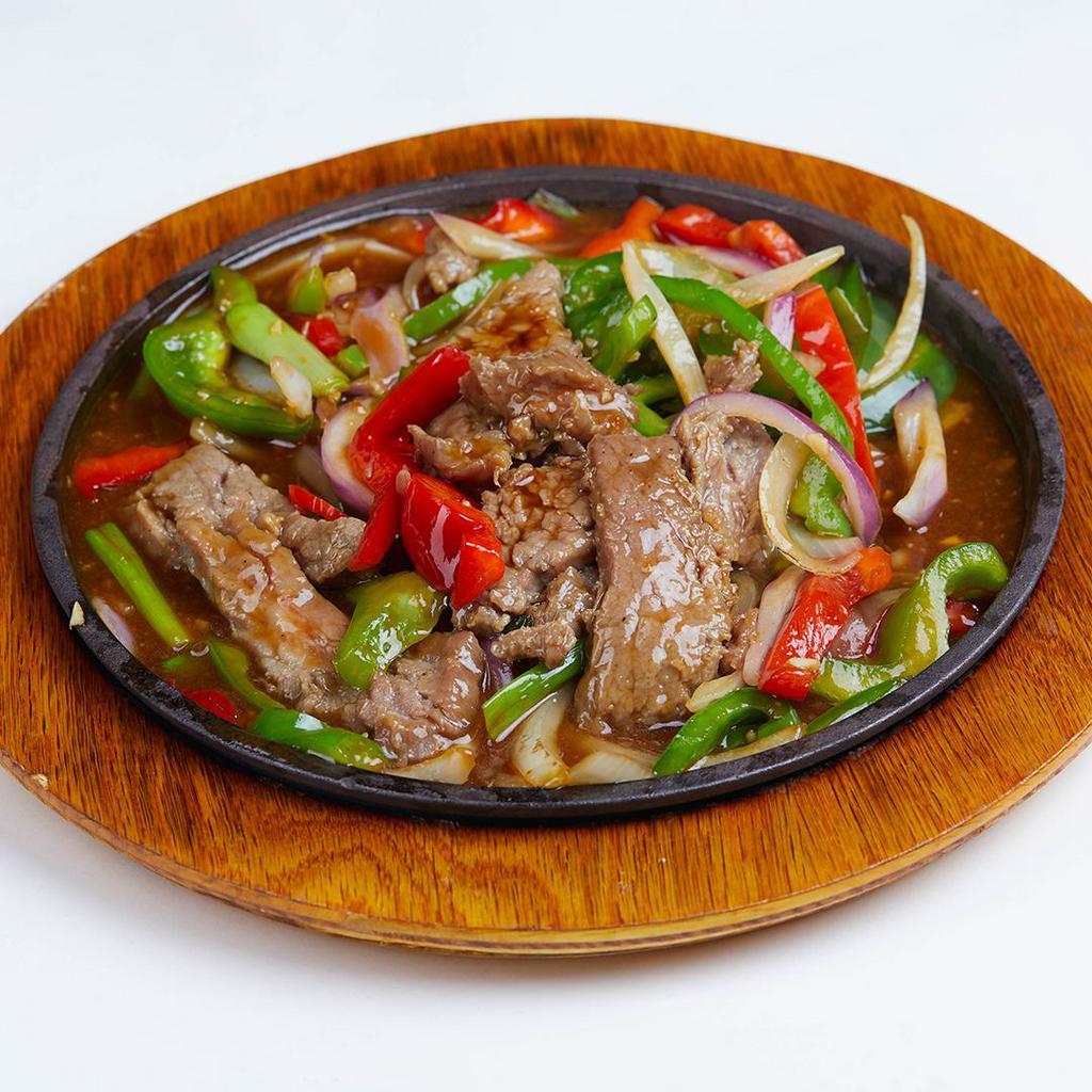 Mongolian Skillet Beef · Marinated slices and sauteed with ginger scallions, onions and bell peppers with chef's brown sauce.