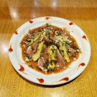 Black Albacore Tuna Tataki · Seared albacore tataki with ponzu sauce with cilantro, garlic, tomato and kaiwari, bonito sp...