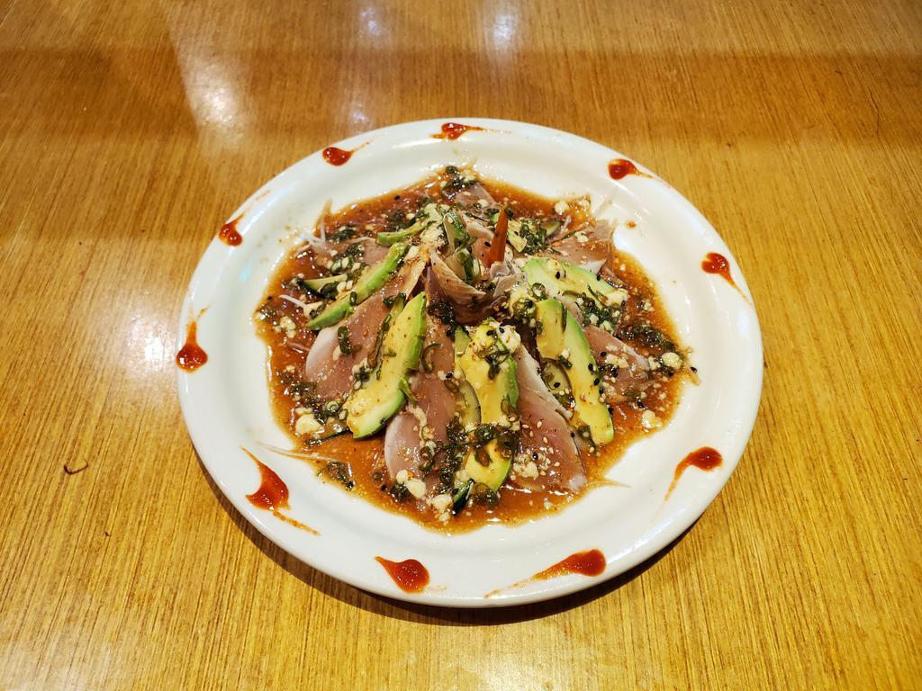 Black Albacore Tuna Tataki · Seared albacore tataki with ponzu sauce with cilantro, garlic, tomato and kaiwari, bonito spicy sauce