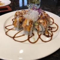84. Volcano Roll · California on top, spicy crab meat, spicy salmon, mozzarella cheese baked and 3 sauce.