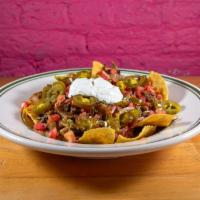 Taco Daddy Nachos · Tortilla chips, melted Jack cheese, pico de gallo, sour cream, and slicep-jalapenos. Add gua...