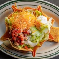 Taco Daddy Salad · Crispy flour tortilla bowl, lettuce, pico de gallo, shredded cheese, ano sour cream with you...