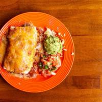 Taco Daddy Burrito · Grande burrito filled with seasoned chicken, beef, rice and beans, topped with ranchera and ...