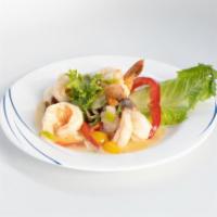 Shrimp Skordates · Lightly sautéed shrimp in a white wine sauce w/ fresh garlic, lemon, & herbs