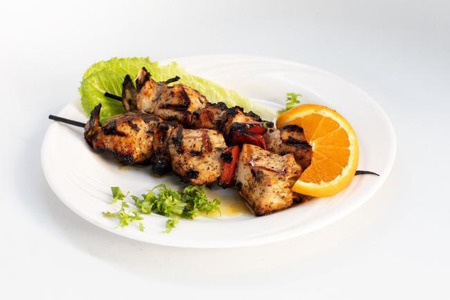 Chicken Souvlaki · Grilled chicken kebab w/ dried dates, topped w/ Greek seasonings