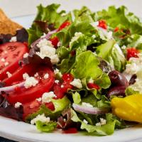 Traditional Greek Salad · Fresh mixed lettuces, tomatoes, cucumbers, roasted red peppers, red onions, feta, pepperonci...
