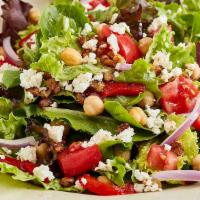 Mediterranean Salad · Contain nuts. Fresh mixed lettuces with garbanzo beans,
roasted red peppers, red onions, dic...
