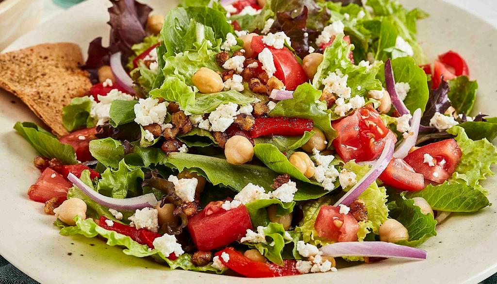 Traditional Mediterranean Salad · Mixed lettuces with garbanzo beans, roasted red peppers, red onions, diced tomatoes, roasted pecans and feta served with Taziki's homemade balsamic vinaigrette. Vegetarian.