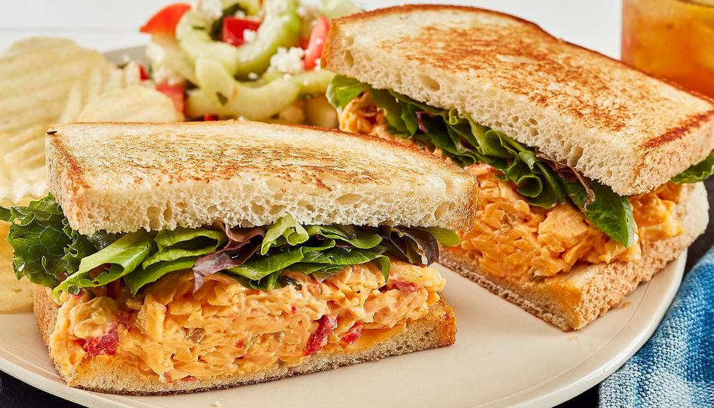 Spicy Pimento Cheese Sandwich · With mixed lettuce on toasted bread. Served with chips and your choice of a homemade side
