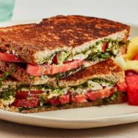 Tomato Basil Sandwich · Feta, tomatoes, fresh basil, and basil-pesto sauce, on toasted bread, served with chips and ...