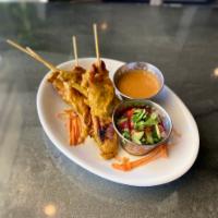 Chicken Satay · Thai marinated grilled chicken on skewers served with peanut sauce and cucumber sauce.