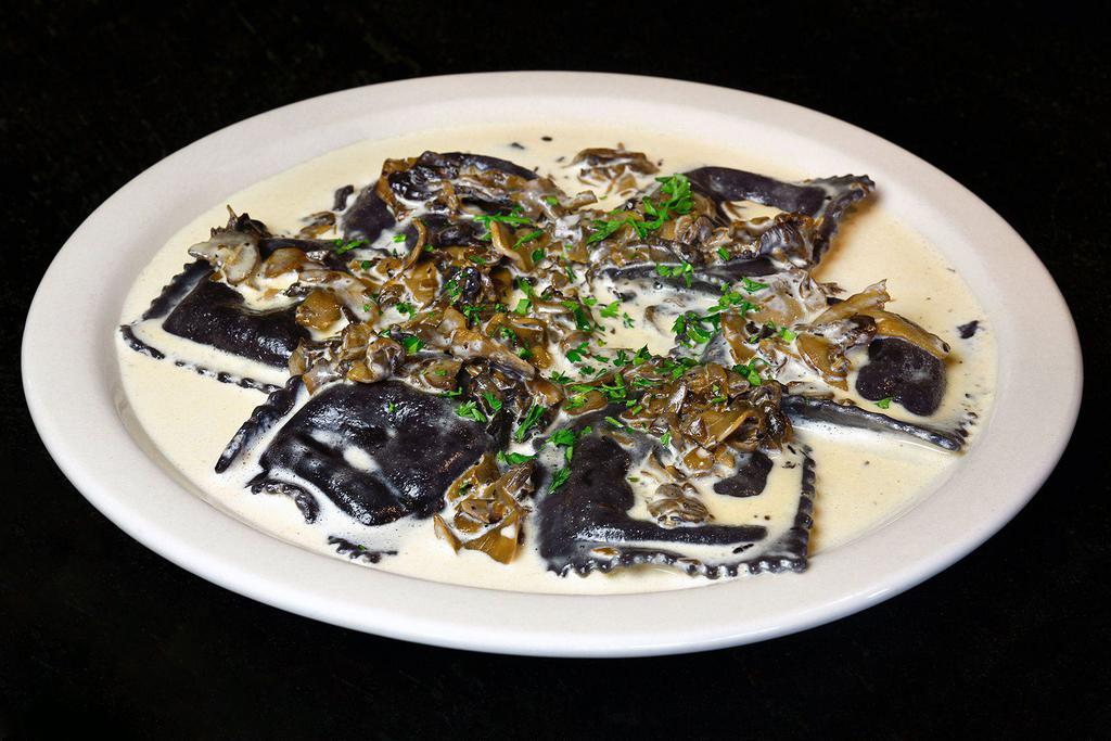 Funghi* · Selection of wild mushrooms with cream and a touch of garlic.