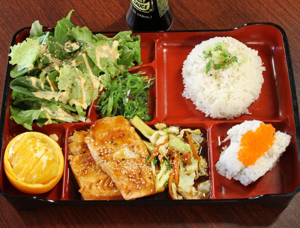 Salmon Teriyaki Bento Box · Served with green salad, seaweed salad, steamed rice, 4pc cal roll, 1pc egg roll and 1pc gyosa.