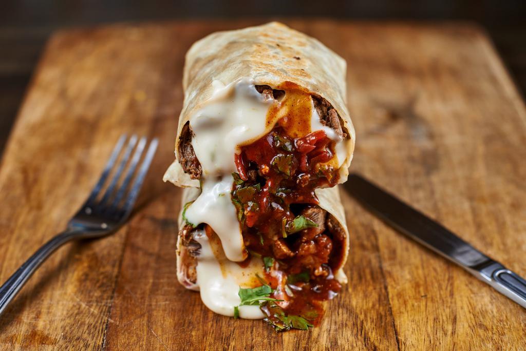 Steak N’ Cheesy Chipotle Burrito · asada marinated grilled angus steak, melted queso, chipotle sour cream, mezclajeté smoked hot sauce, cilantro, pickled red onions, flour tortilla