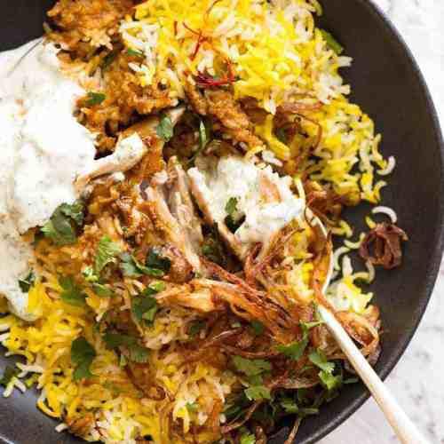 Saffron Biryani · Chicken, lamb, shrimp and vegetables cooked with basmati rice, fresh herbs freshly ground Indian spices and garnished with almonds.