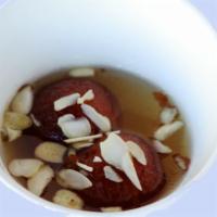 Gulab Jamun · A light pastry dumpling made with fresh milk and sweet honey (served warm).