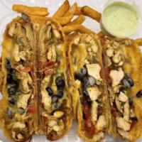 All Fajita Deluxe EggRolls · Grilled chicken, black beans, sauteed peppers, onions and Mexican cheese. Two per order. 