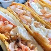 All Seafood Deluxe EggRolls · Shrimp, crab, lobster and fresh cheese. Two per order.