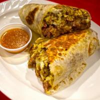 Breakfast Burrito · Our Breakfast Burrito consists of: Your choice of meat, two scrambled eggs, pot beans, saute...