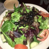 Garden Salad · Mixed greens lettuce with tomato, cucumbers, and black olives with our house balsamic vinaig...