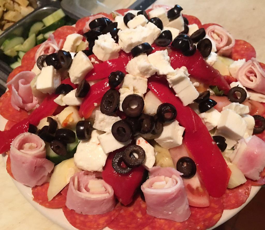 Cold Antipasto · Pepperoni, tomatoes, cucumbers, black olives, giardiniera, house-made roasted peppers, artichoke hearts, fresh mozzarella, ham, salami and provolone with creamy balsamic vinaigrette on the side. Gluten free.