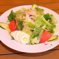 Garden Salad · Mixed greens, cucumbers, tomatoes, carrots, red onions, and hard-boiled egg. 
