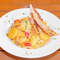 Shrimp and Linguine  · Sauteed with lemon, garlic,  saffron and white wine sauce, served with garlic bread.