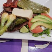 Bistec Ranchero Platillo · Ranch steak. Grilled steak with hot peppers, onions and grilled cactus. Served with rice, be...