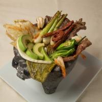Molcajete Inn Platillo · Grilled pork chop, chicken, beef, 4 shrimps, Mexican sausage, cactus, hot peppers, onion and...