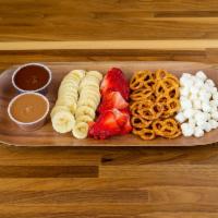 Fondue · Pick 2 types of chocolate. Comes with bananas, strawberries, pretzels and marshmallows.