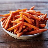 Sweet Potato Fries · Thin cut sweet potato fries, fried golden.