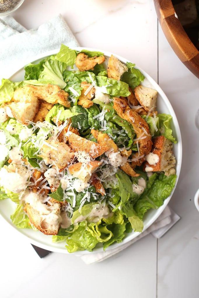 4. Chicken Caesar Salad · Romaine, grilled chicken, shaved Parmesan, multigrain croutons, and Caesar dressing.