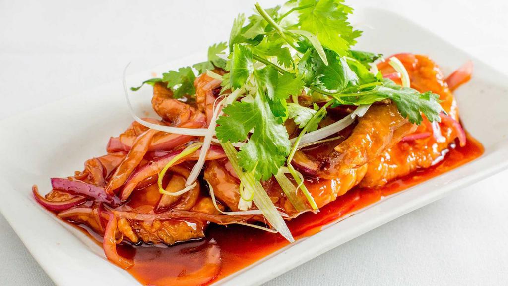 Peking Pork Chops · Fried pork chops sauteed in sweet and sour sauce.