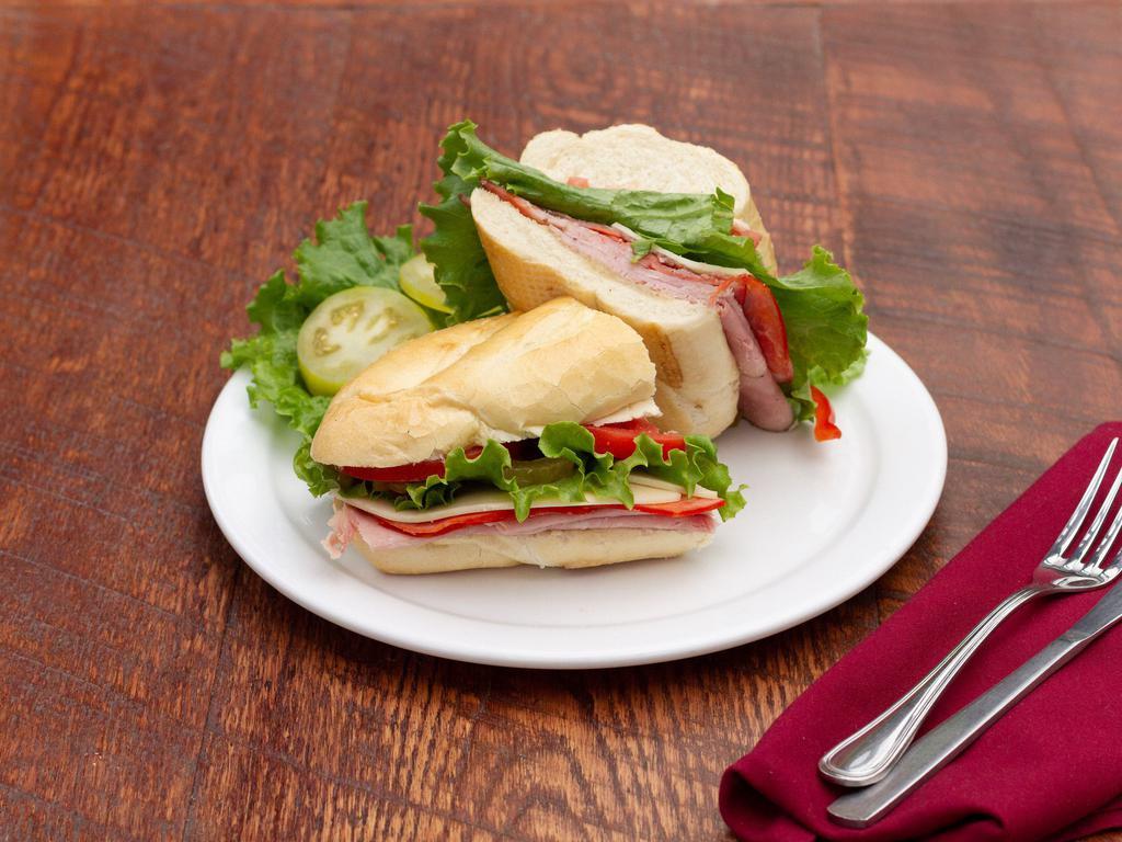 Italian Cold Cut Sandwich · Cappicola ham, salami, peppered ham, Swiss, oil and vinegar, lettuce, tomato on a French roll.