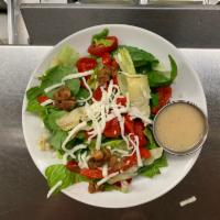 Oceanside Summer Salad · Baby spinach, artisan romaine, grape tomato, candied walnuts, artichoke hearts, roasted red ...